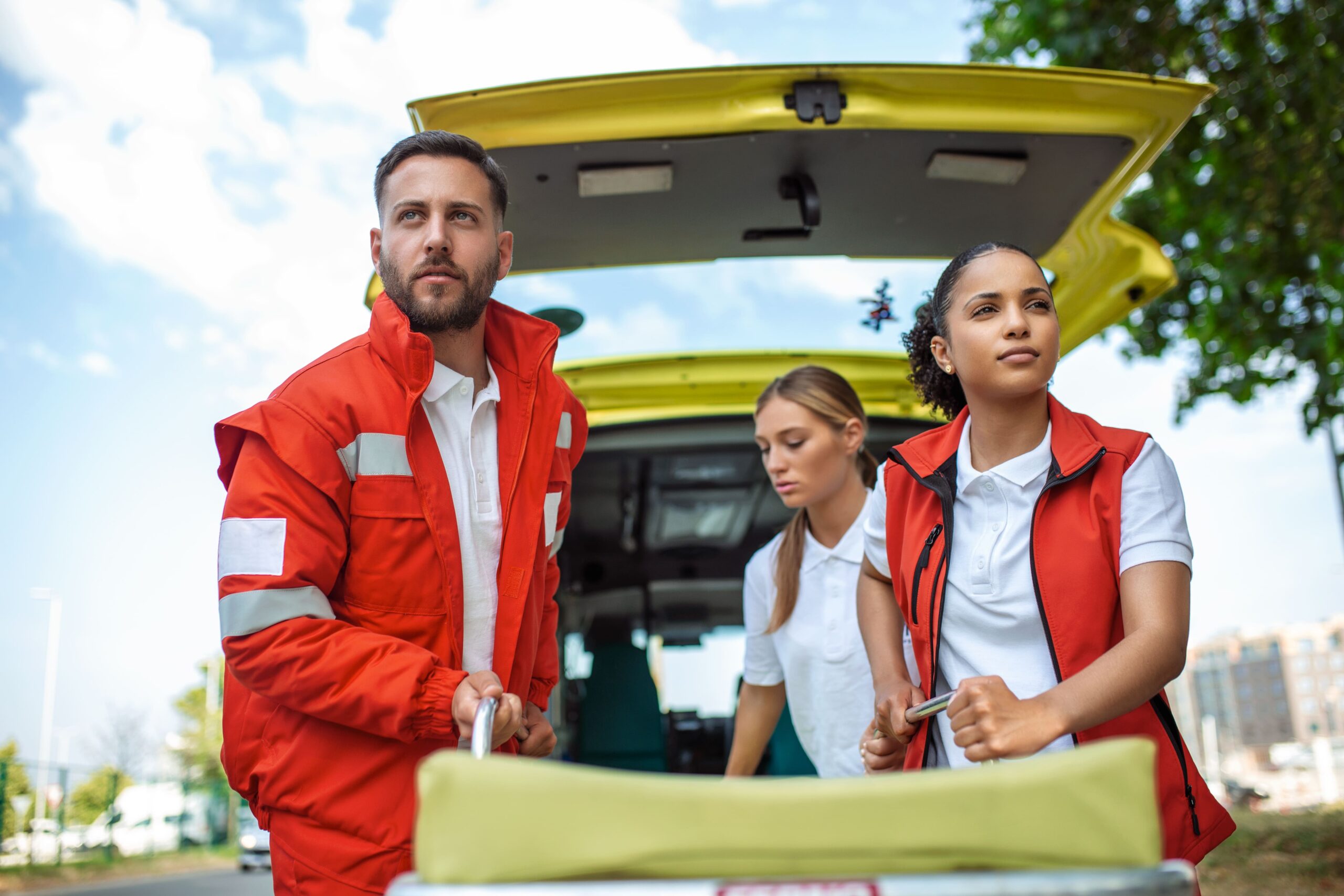 young-paramedics-moving-ambulance-stretcher-from-car-hurry-paramedics-uniform-taking-stretcher-out-ambulance-car (1)